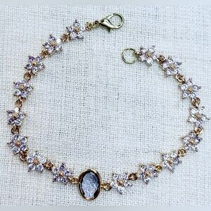 18K gold plated bracelet w light purple CZ flowers,lolite oval quartz charm.7.5”